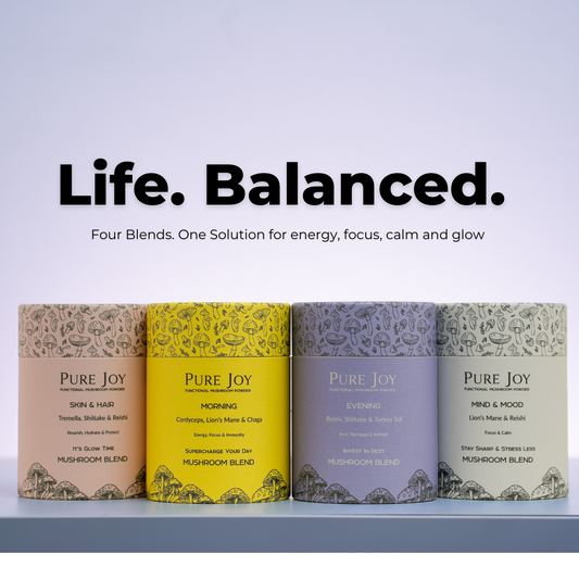 Midlife professional woman feeling stressed at work — blog on hidden stress triggers and natural stress relief with functional mushrooms.