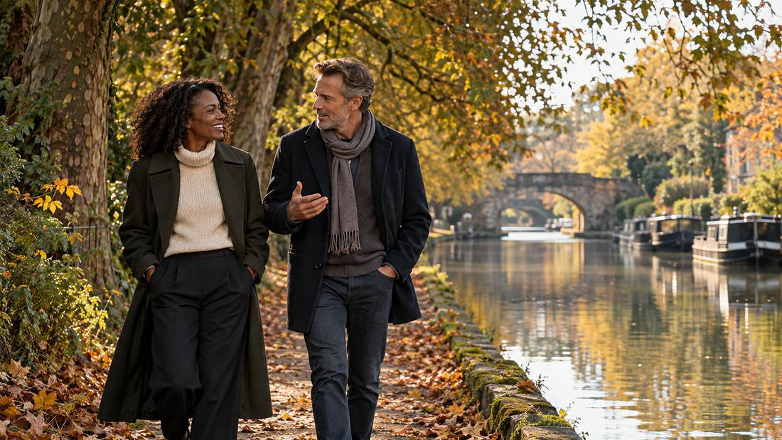 Two friends talk while taking an autumn walk after work.