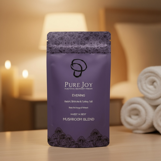 Purple package labeled 'Pure Joy Mushrooms Evening Blend on a wooden surface with a blurred background