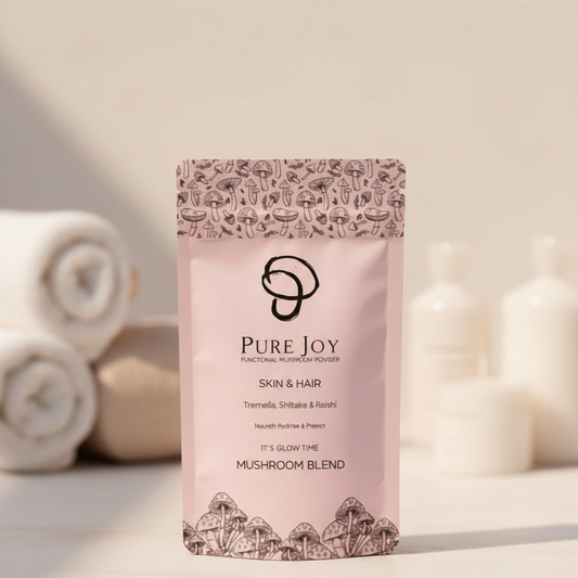 Pink packaging of Pure Joy Skin & Hair Mushroom powder product on a light background